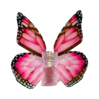 Dark pink acetate large butterfly-shaped hair claw clip with sculptural wings and a secure claw closure.