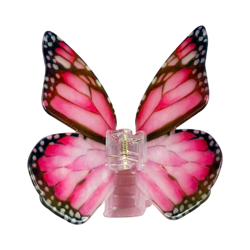 Dark pink acetate large butterfly-shaped hair claw clip with sculptural wings and a secure claw closure.