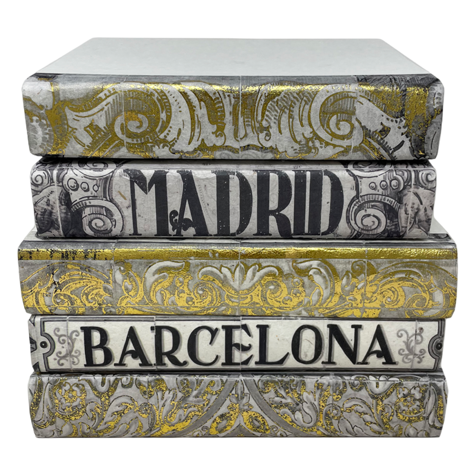 Stack of decorative books with 'Madrid' and 'Barcelona' on a white background