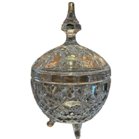 Decorative crystal container with a lid on a white background