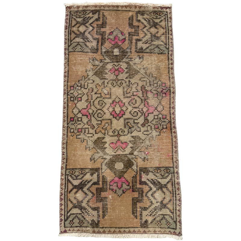Decorative rug with intricate patterns on a plain background