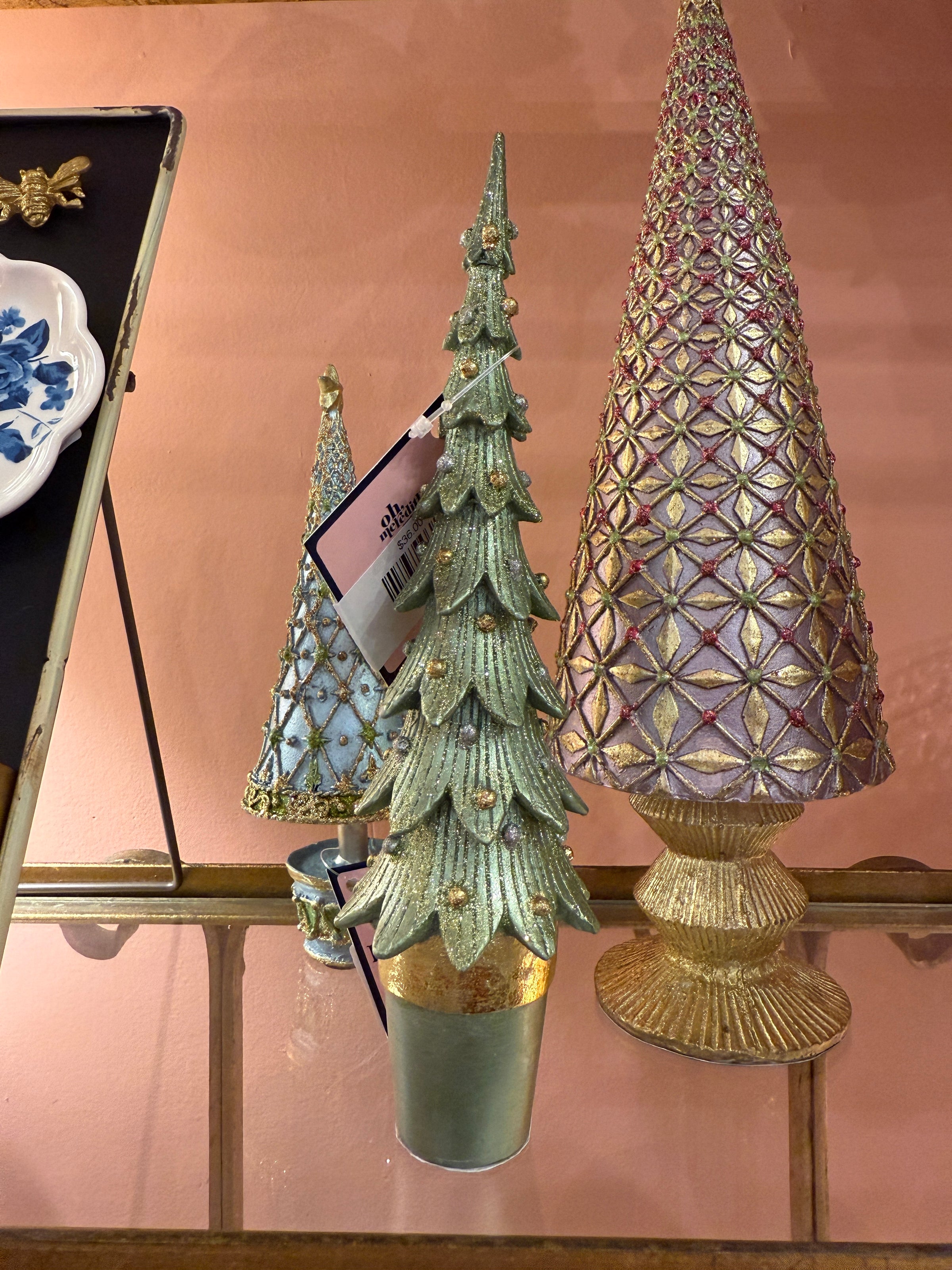 Decorative lamp with green leaf design on a pink background