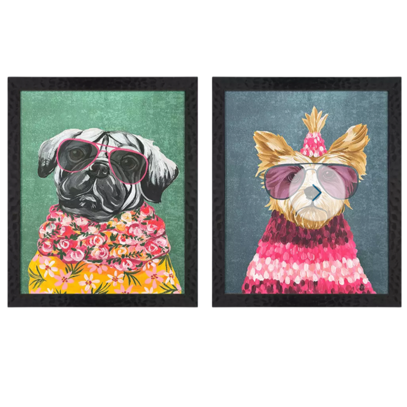 Two framed illustrations of dogs wearing colorful outfits on a white background