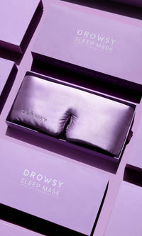 Drowsy sleep mask in packaging with a purple theme