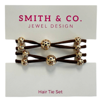 Hair tie set with gold beads on a Smith & Co. card