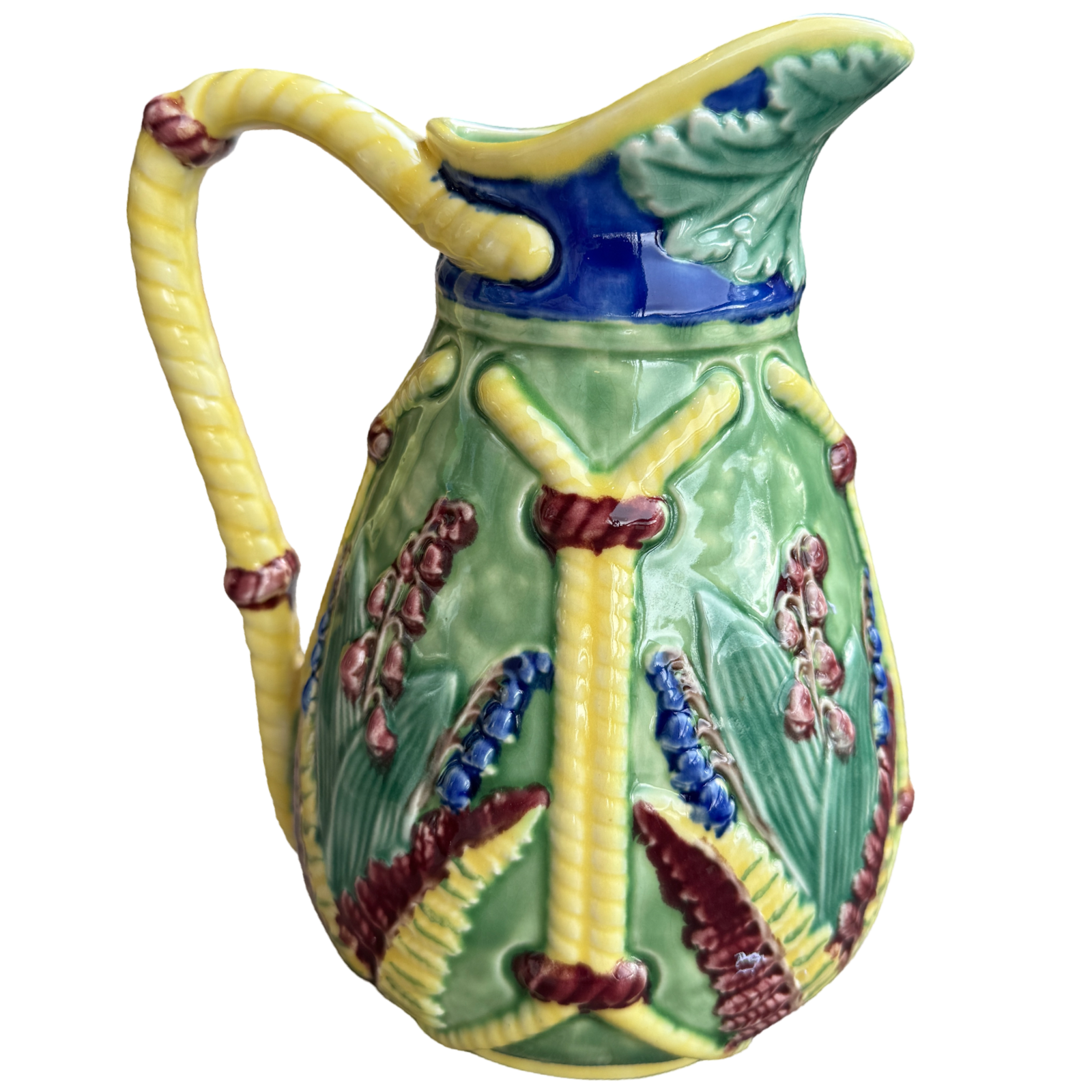 Decorative ceramic pitcher with floral patterns on a white background