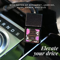 Car diffuser with floral design on a car dashboard, featuring notes of bergamot, jasmine, musk, amber, and oud.