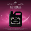 Black bottle of Honestly Margo Goddess Luxe Laundry Wash on a pink background
