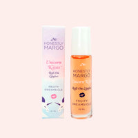 Roll-on lipgloss with packaging labeled 'Honestly Margo Unicorn Kisses' on a light pink background