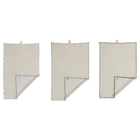 Three beige towels hanging on a white background