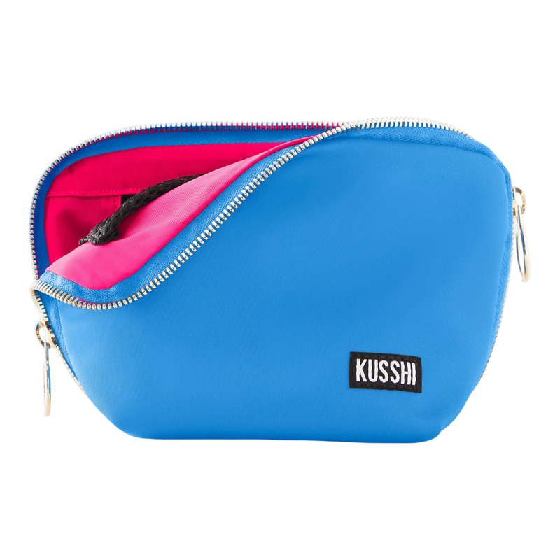 kusshi everyday makeup bag, light blue makeup bag, kusshi cosmetic bag, neon pink interior bag, travel makeup bag, stylish toiletry bag, kusshi blue pink bag, everyday beauty bag