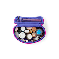 Purple makeup case with various cosmetic items on a white background