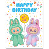 Children's birthday card with two kids in colorful bunny costumes holding a balloon.