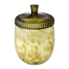 Decorative glass jar with a ribbed lid on a white background