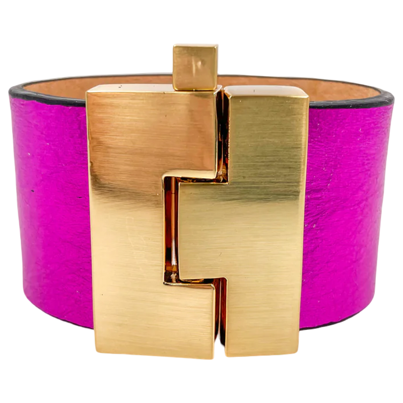 Gold bracelet with a pink band on a white background