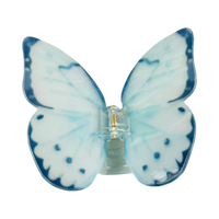 Light blue acetate large butterfly-shaped hair claw clip with sculptural wings and a secure claw closure.