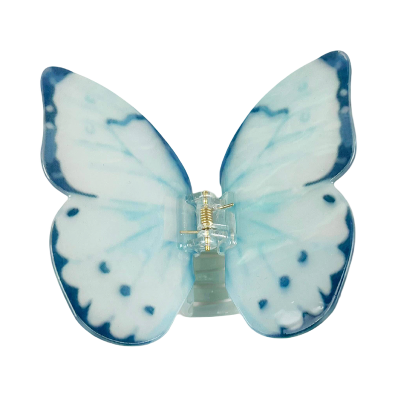 Light blue acetate large butterfly-shaped hair claw clip with sculptural wings and a secure claw closure.