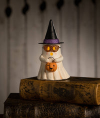 Bethany Lowe Designs Witchy Ghost with Pumpkin Halloween figurine wearing a pointed witch hat and holding an orange pumpkin trick-or-treat bucket.