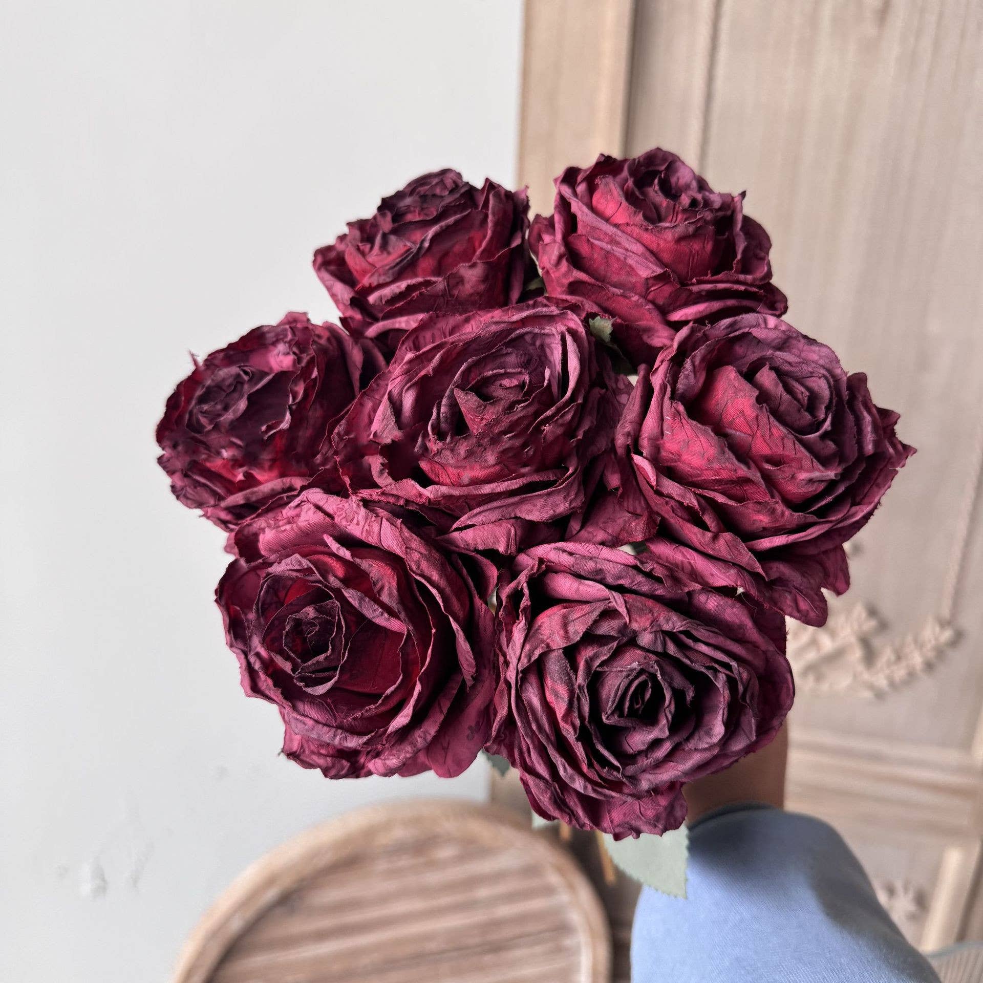 Burgundy vintage-style faux rose bouquet with seven full layered rose stems and leaves