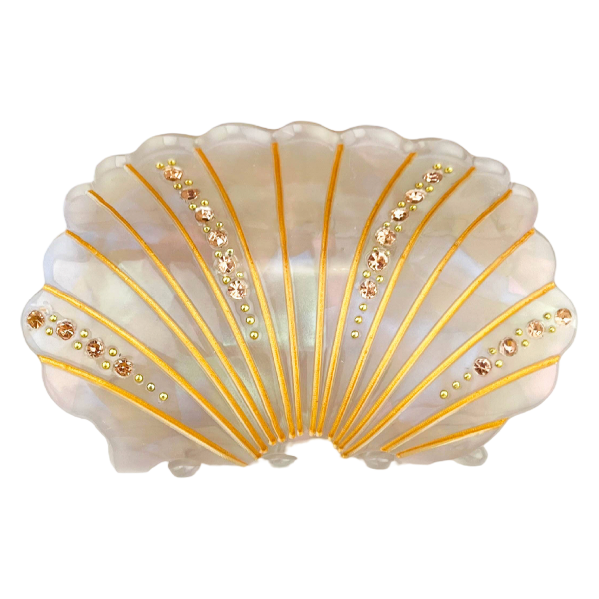 A scalloped shell-shaped dish with an iridescent white and pale pink shell-like surface, decorated with gold radial lines and rows of small rhinestones, shown on a plain white background.