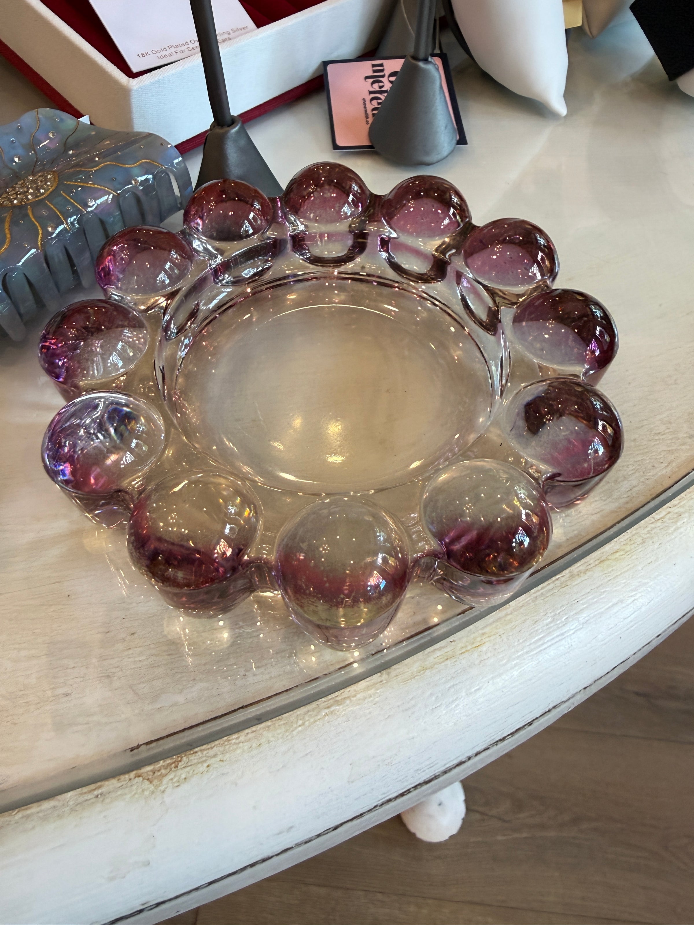 Vintage smoky pink Boopie-style glass bowl with oversized rounded bubble rim viewed from above.