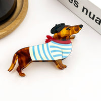 Blue acetate dachshund-shaped hair claw clip featuring a playful black beret detail.