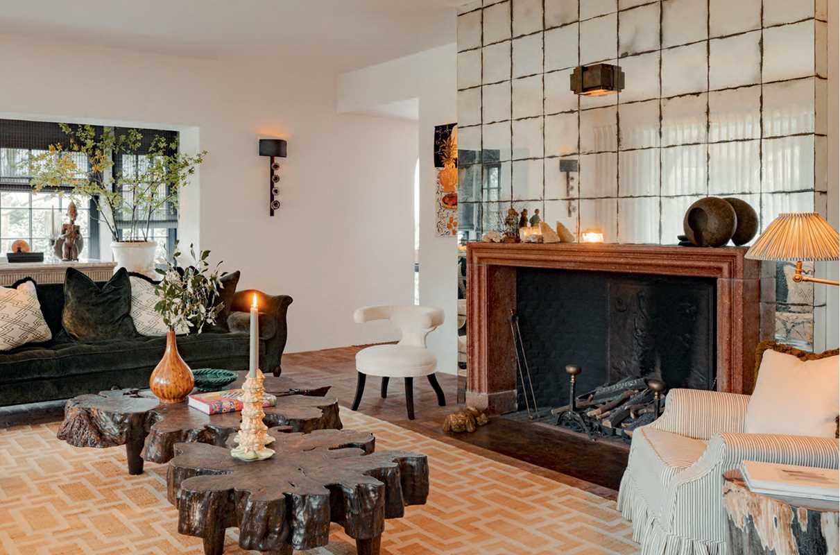 Living room with a fireplace, decorative table, and modern decor.