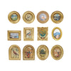 Collection of gold-framed pictures with various scenes on a white background