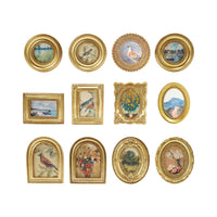 Collection of gold-framed pictures with various scenes on a white background