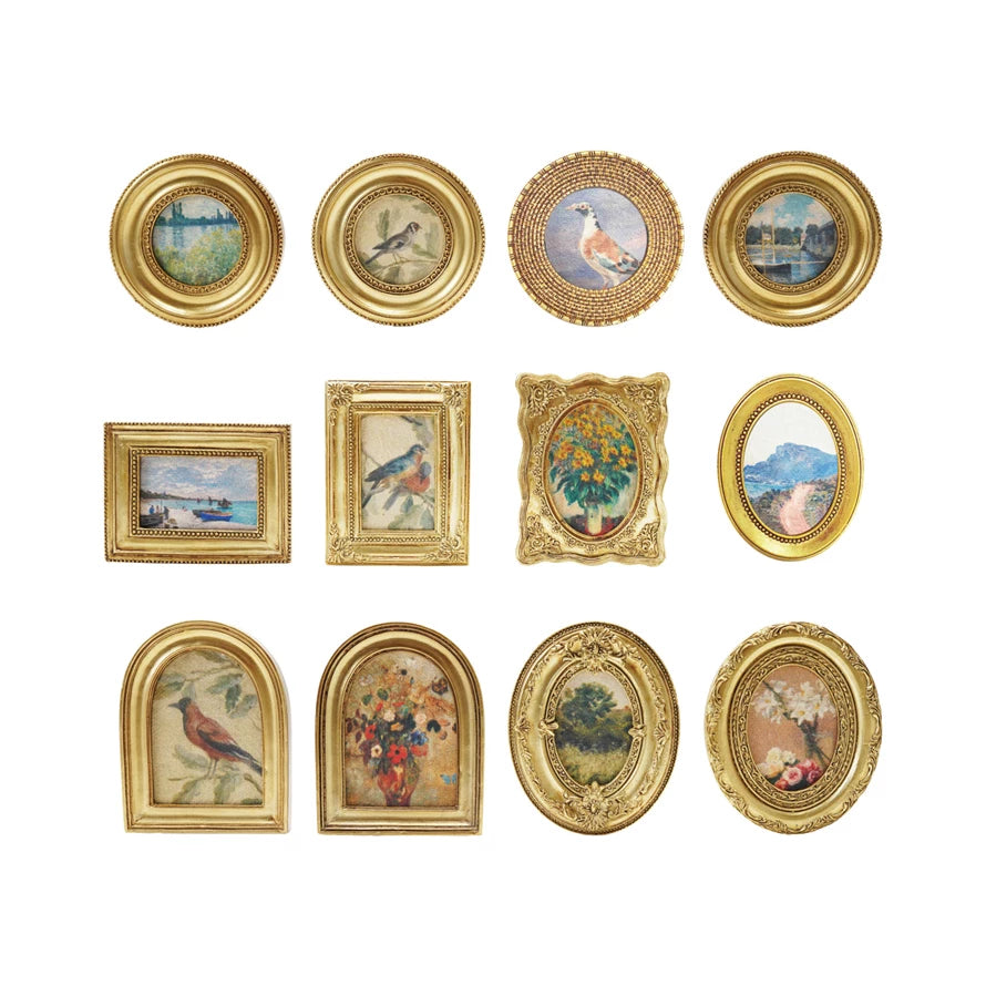 Collection of gold-framed pictures with various scenes on a white background