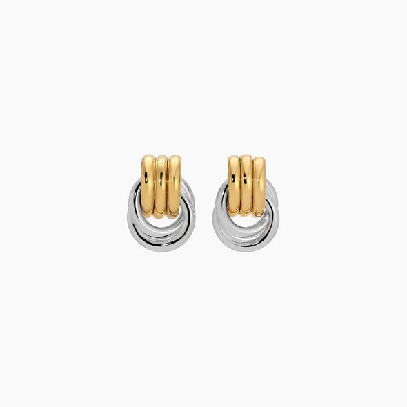 Pair of gold and silver hoop earrings on a white background