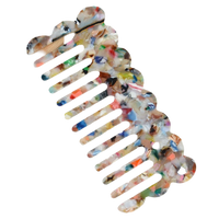 Multicolor acetate wide-tooth hair comb with smooth curved teeth for detangling straight, wavy, and curly hair.