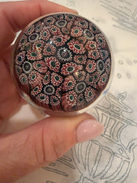 murano paperweight, millefiori paperweight, vintage murano glass, Italian art glass, burgundy glass decor, collectible glass paperweight, murano millefiori, vintage Italian decor, bookshelf decor, coffee table styling, collectible art glass, grandmillennial decor, maximalist home decor, vintage collectible, Italian glass collectible, decorative object, colorful home accessories, murano collectible, vintage home accents, art glass decor