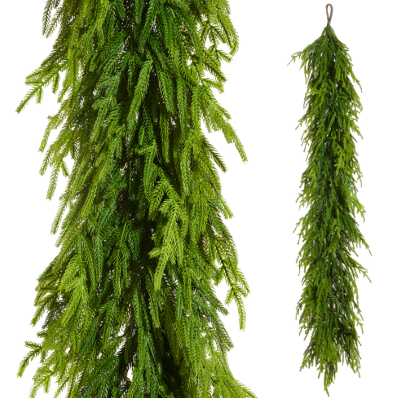 Two artificial green garlands hanging against a white background