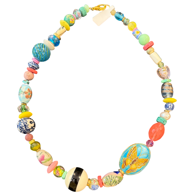 Colorful beaded necklace with various shapes and patterns on a white background