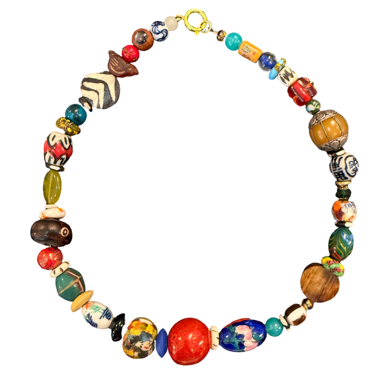 one of one necklace, collected bead necklace, artisan necklace, statement bead necklace, maximalist jewelry, wearable art necklace, eclectic jewelry, chunky bead necklace, earthy jewelry, resort jewelry, boho luxury jewelry, curated accessories, globally inspired jewelry, boutique jewelry, fashion jewelry, artistic statement necklace, collector style jewelry, unique artisan necklace, travel inspired jewelry, earthy statement accessories
