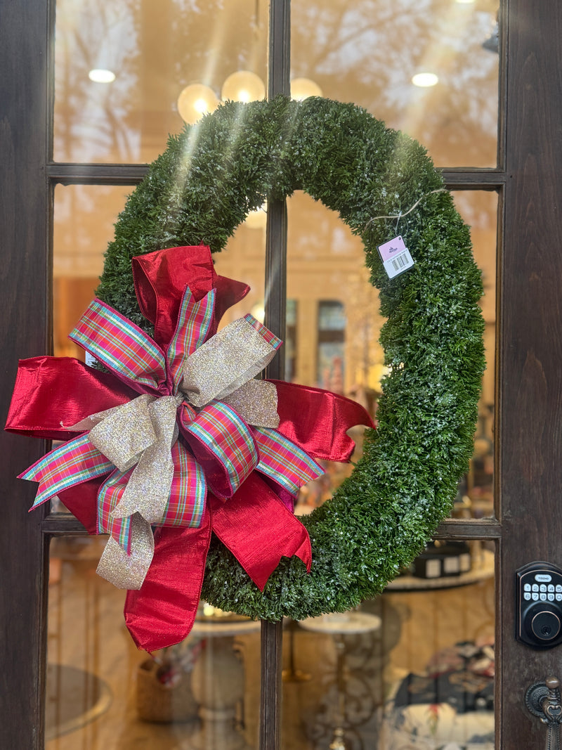 Raz Imports Oval Door Wreath adorned with a big decorative bow