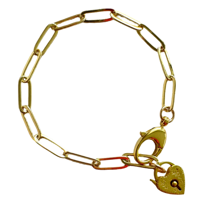 Gold chain bracelet with a heart-shaped padlock charm on a white background