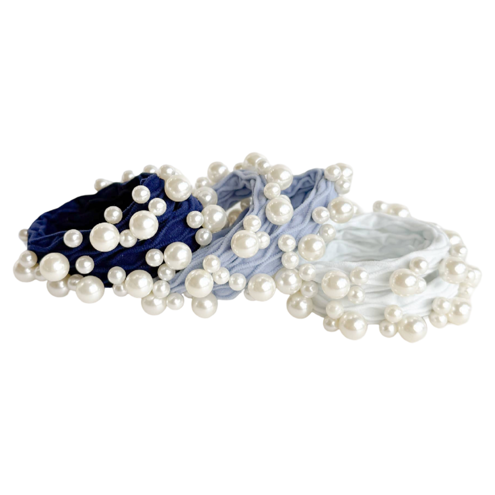 Set of pearl hair ties in blue, gray, and white on a white background