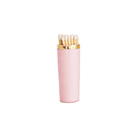 Pink matches with gold cap on a white background