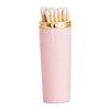 Pink matches holder with gold top on a white background