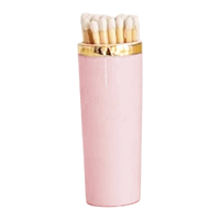 Pink matches holder with gold top on a white background
