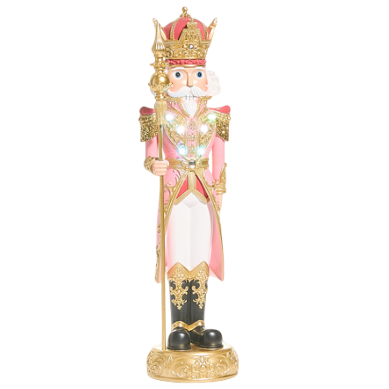 Decorative figurine of a king in ornate clothing on a white background