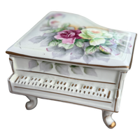 Decorative music box with floral design on the lid