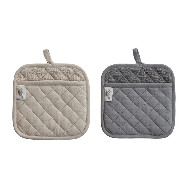 Two quilted pot holders, one beige and one gray, on a white background.