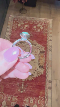 showcasing how the qudo jewelry interchangeable jewelry works by screwing the swarovski crystal on and off the silver basic deluxe ring band