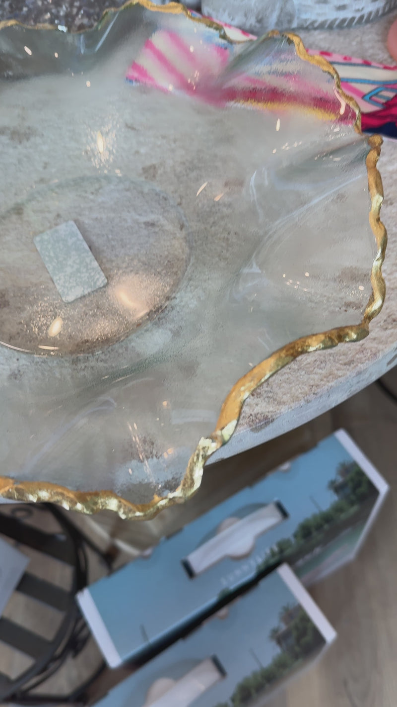 decorative glass bowl with a gold rim edge