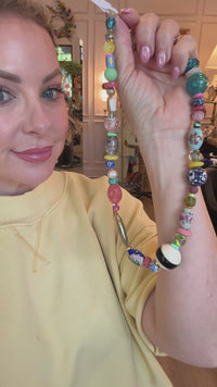one of one necklace, beaded statement necklace, collected bead necklace, chunky bead necklace, eclectic jewelry, maximalist jewelry, colorful bead necklace, porcelain bead necklace, glass bead necklace, artisan necklace, vacation jewelry, resort accessories, boho luxury jewelry, unique statement necklace, layered jewelry trend, wearable art necklace, boutique jewelry, fashion bead necklace, coastal grandmother jewelry, european summer accessories