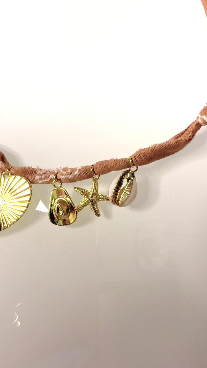 Mandriana bandana necklace, handmade charm necklace, desert chic jewelry, golden cross and heart necklace, boho talisman necklace, cowrie shell necklace, rust bandana jewelry, starfish and horseshoe necklace, symbolic charm choker, one-of-a-kind boho accessories