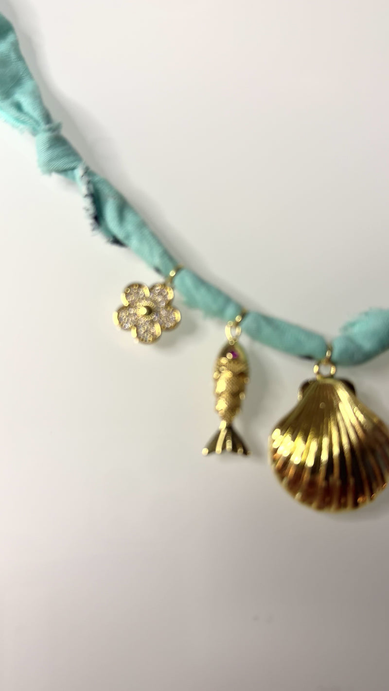 Mandriana, scarf necklace, shell charm necklace, ocean inspired jewelry, coastal style accessory, seafoam green bandana necklace, fish charm, horseshoe necklace, beachy boho jewelry, handmade charm necklace, unique summer necklace, mermaidcore accessory, one of a kind jewelry, artisanal necklace